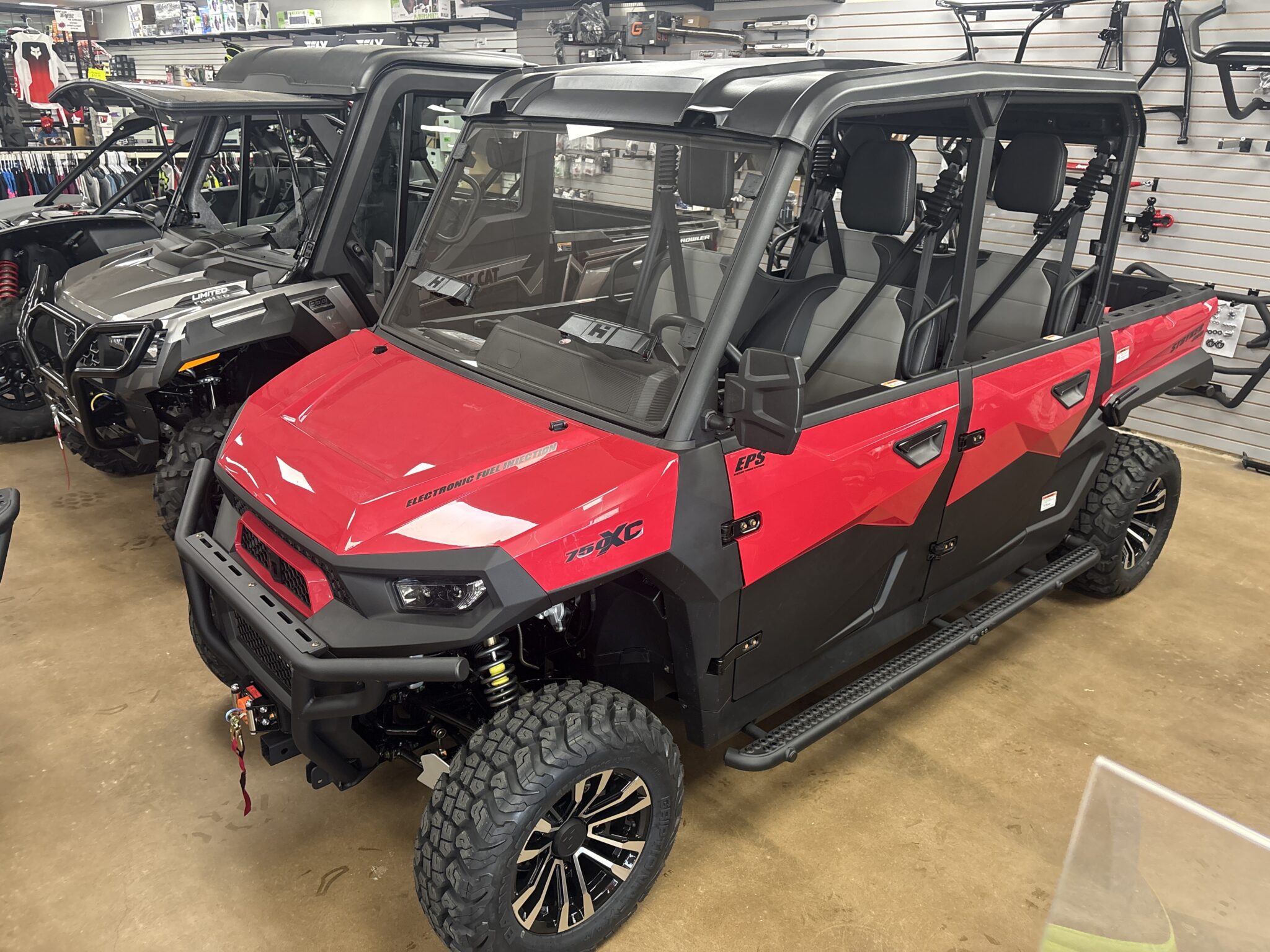 Red utility vehicle in the Ison Powersports showroom